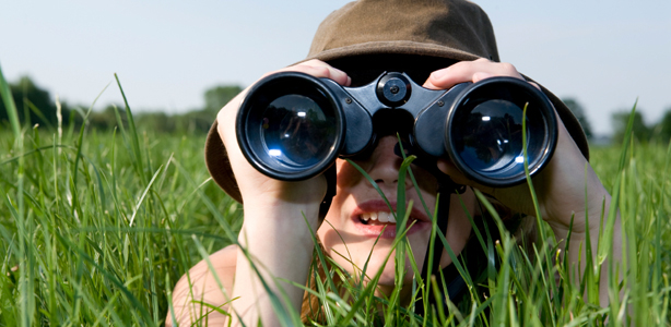 woman-with-binoculars-in-grass-1